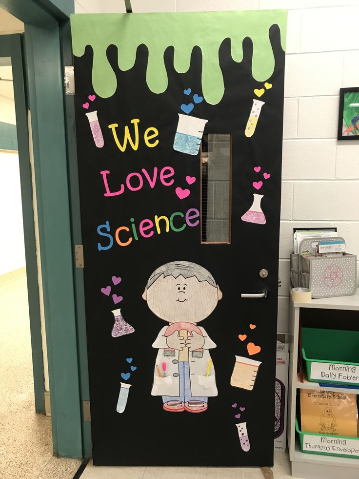 a classroom door decorated with an image of a scientist