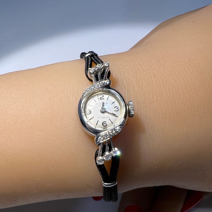 A free gift of a trendy silk bracelet is included with your purchase. At this time we are offering a free $400 restoration which includes cleaning and polishing. This is done prior to shipment so please allow 7 to 10 days for this work. Length: 7 1/2 inches. Can be sized down. Mechanical movement Elegant Diamond Watch With Bracelet Strap, Evening Diamond Jewelry With Bracelet Strap, Elegant Adjustable Bracelet Strap For Jewelry And Watches, Elegant Evening Diamond Watch With Bracelet Strap, Elegant Adjustable Watch With Round Dial, Timeless Evening Diamond Watch With Bracelet Strap, Elegant Adjustable Jewelry With Round Dial, Adjustable Diamond Jewelry For Evening, Elegant Silver Diamond Watch For Party