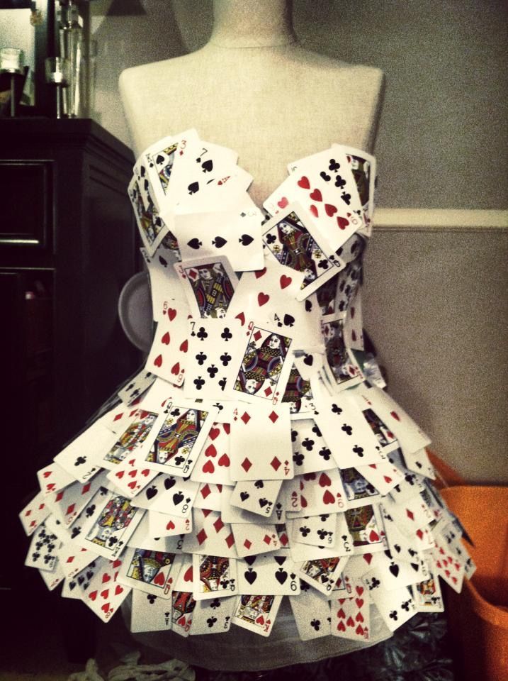 a dress made out of playing cards on a mannequin