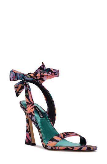 A delicate ankle tie and sculpted heel elevate a contemporary sandal that will complement your event-ready ensemble. 3 3/4" heel Synthetic or textile upper/synthetic lining and sole Imported Ankle Tie Sandals, Tropical Floral Print, Tropical Floral, Sandal Women, Sling Backs, Nine West, Womens Sandals, Floral Print, Floral Prints