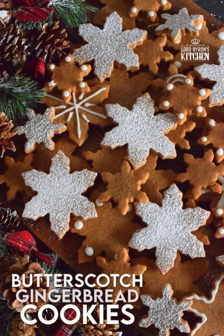 christmas cookies are arranged on a platter with pine cones