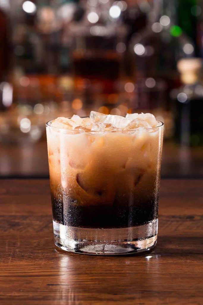 an iced drink sitting on top of a wooden table