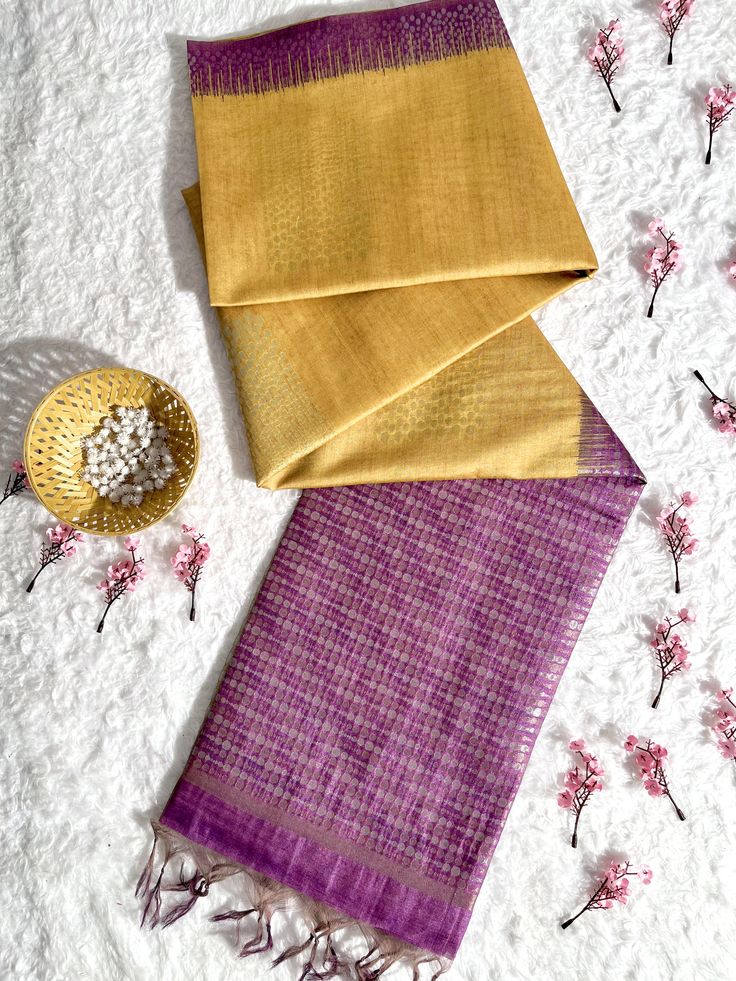 Fabric Details : Indulge in luxury with our Gold Yellow Premium Tussar Silk Saree. Made from high quality and rare Tussar silk, this saree offers a luxurious drape and a soft feel against the skin. Elevate your style with the natural shine and unique texture of this premium fabric. Saree Color : Gold Yellow Saree Work : Thread Woven Saree Length : 5.5 Meter Blouse Length : 0.8 Meter Wash : Dry Clean Product color may little differ as per the brightness or color settings of your device. Fusion Style Silk Saree With Dupatta, Fusion Style Silk Pre-draped Saree With Traditional Drape, Fusion Style Silk Pre-draped Saree, Fusion Silk Pre-draped Saree With Dupatta, Fusion Style Silk Pre-draped Saree With Cutdana, Silk Fusion Blouse Piece With Traditional Drape, Fusion Silk Pre-draped Saree For Festivals, Festive Fusion Silk Pre-draped Saree, Festive Fusion Silk Blouse Piece