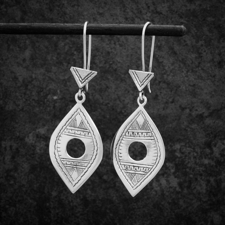 These stunning unique earrings are handmade in sterling silver and inspired by a traditional Tuareg design from North Africa. A contemporary take on a traditional tribal design.  Dimensions (approx):  * Length: 6cm including hook * Width: 2cm  Materials: * Sterling Silver Beyond Biasa creates unique jewellery that is inspired by antique and tribal designs from around the globe. All of our pieces are handmade so please allow for slight variations in size and colour. Ethnic Earrings, Gemstone Necklace Pendant, Labradorite Pendant, Everyday Earrings, Silver Drop Earrings, Earrings Boho, Gold Texture, Unique Earrings, Boho Earrings