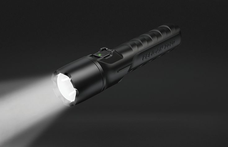 a flashlight is lit up on a black background with the light shining through it's lens