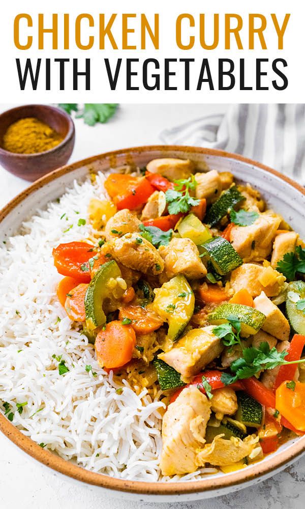 chicken curry with vegetables and rice in a bowl