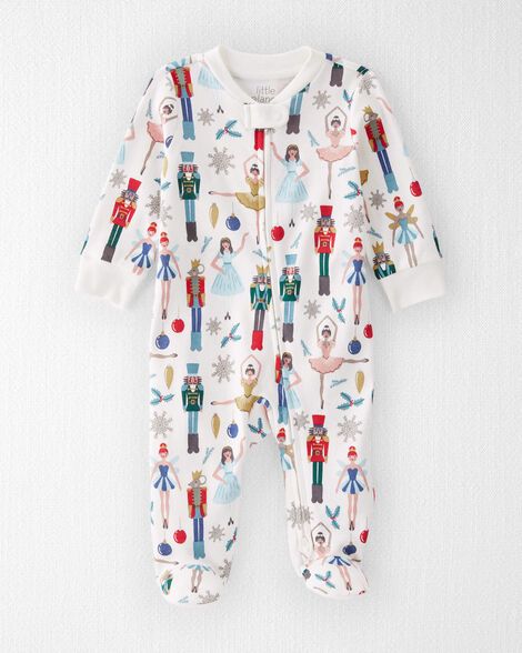 Designed in the softest organic cotton and made with baby's comfort in mind, this sleep & play is full of thoughtful details like a 2-way zipper to keep baby's arms & torso warm during diaper changes, plus built-in footies to keep tiny toes cozy. Featuring our holiday nutcracker print, this 1-piece is naturally charming and inspired by the holiday season. Crafted in the purest organic fabrics and sustainable materials, Little Planet is a return to simplicity. Thoughtful essentials and timeless pieces to gift or to hold on to. Kids Christmas Pajamas, Sweet Cream, Footie Pajama, Carters Baby Boys, Baby Cover, Baby Comforter, Carters Baby, Gender Neutral Baby Clothes, Organic Fabrics