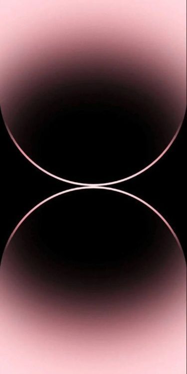 an abstract black and pink background with two circles in the center, one circle is slightly blurry