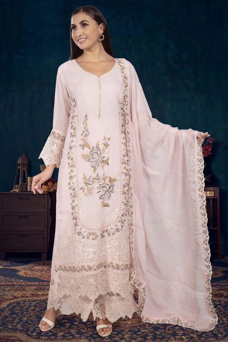 Indulge in elegance with our Partywear Suit D-241. Adorned with exquisite pearl and floral thread embroidery, this suit exudes sophistication and luxury. Elevate your style and make a statement at any special occasion with this premium piece. Wedding Palazzo Set With Floral Embroidery In Raw Silk, Wedding Palazzo Set With Floral Embroidery For Diwali, Wedding Palazzo Set With Floral Embroidery, Wedding Dola Silk Kurta With Floral Embroidery, Anarkali Palazzo Set With Floral Embroidery For Weddings, Formal Chanderi Traditional Wear With Floral Embroidery, Wedding Palazzo Set With Floral Embroidery And Straight Kurta, Elegant Pink Chanderi Palazzo Set, Festive Wedding Palazzo Set With Floral Embroidery