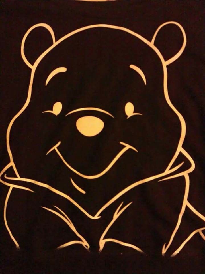 a t - shirt with an image of a bear on it