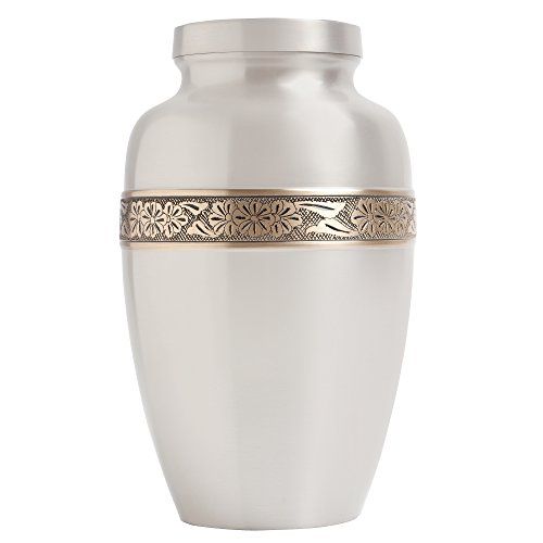 a large silver urn with gold trimmings