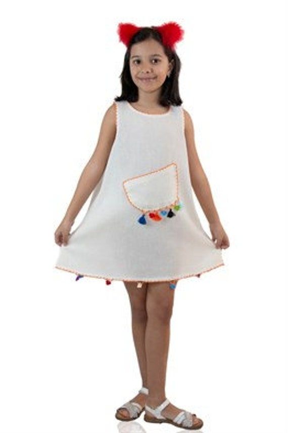 100% cotton shile fabric summer dress for kids. Scoop neck and sleeveless. Embroidered  on neck, sleeve and hem line. A decorative pocket on the front. This is a very cute ,and comfortable dress. The fabric is ideal for hot summer days. Available color is cream powder and available sizes are 1-2;2-3;4-5;5-6;7-8; and 9-10 years old. Your little one will really like this dress' look and comfort. Size                  Chest                             Length 2-3               60 cm /24 inches          46 cm/18 inches 4-5               64 cm  /25 inches         52 cm/21 inches 5-6               72 cm /28 inches          56 cm/22 inches 7-8                80 cm/31.5 inches        60 cm/24 inches 9-10             88 cm/35 inches            65 cm/26 inches White Casual Dress With Side Pockets, Casual White Dresses With Side Pockets, Casual White Dress With Side Pockets, Cute Cotton Sleeveless Dress For The Beach, Cute Cotton Sleeveless Beach Dress, Playful Summer Dresses With Pockets, Playful White Sundress For Beach, Sleeveless Cotton Sundress With Pockets, Cute Cotton Sleeveless Dress For Vacation