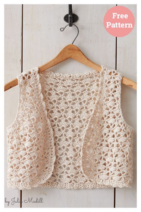 a crocheted top hanging on a wooden hanger with the text free pattern