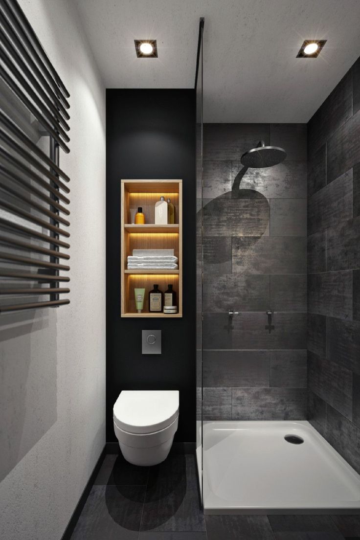 a bathroom with black walls and white fixtures