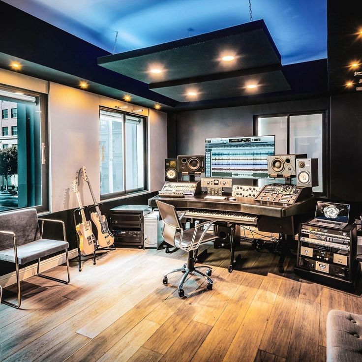 a recording studio with many equipment and lights