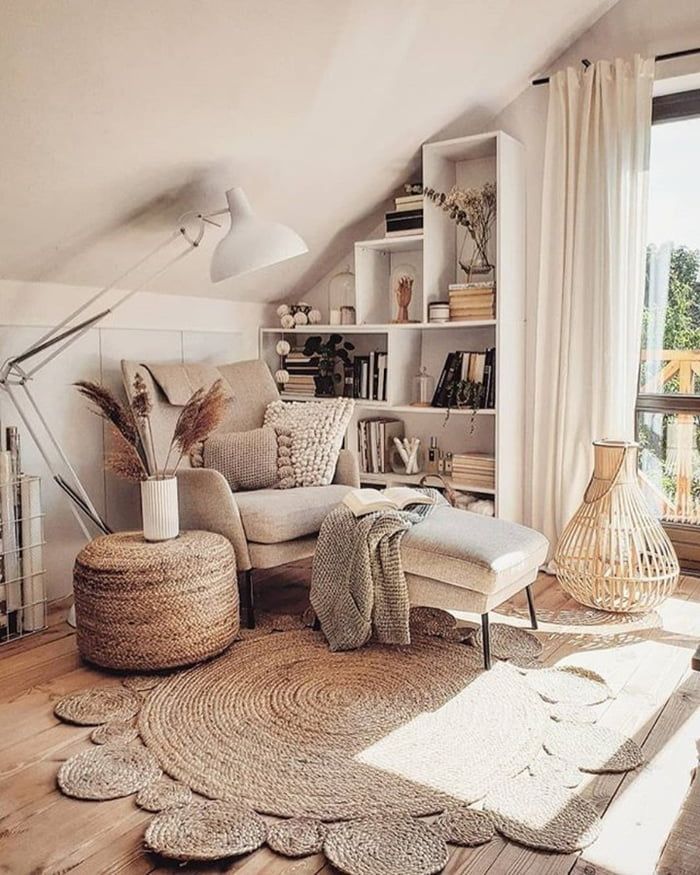 a living room filled with lots of furniture and rugs on top of a hard wood floor