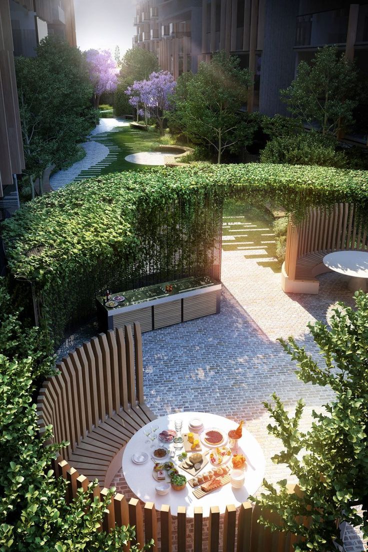 an aerial view of a table with food on it in the middle of a garden