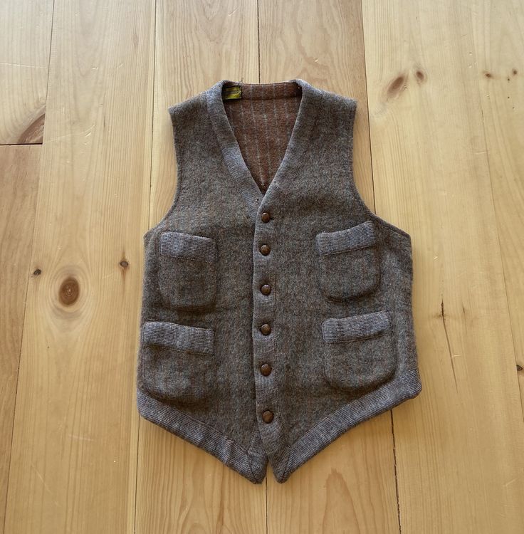 "1910s brown wool waistcoat. Small seam wear on the bottom and a visible (not award winning) repair on the back. Has some nibbles and signs of wear but in very wearable vintage condition.  Shoulder: 11.5\" Chest : 32\" Length : 21\"" Vintage Workwear Vest With Pockets, Vintage Vest With Pockets For Work, Vintage Fall Vest With Buttons, Vintage Buttoned Winter Vest, Vintage Buttoned Vest For Winter, Vintage Winter Vest With Button Closure, Vintage Winter Vest With Buttons, Brown Wool Sweater Vest For Workwear, Brown Single-breasted Sleeveless Vest