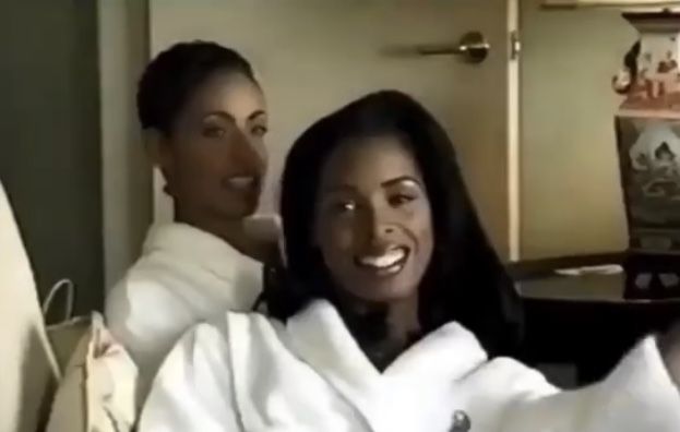 two women in bathrobes are taking a selfie