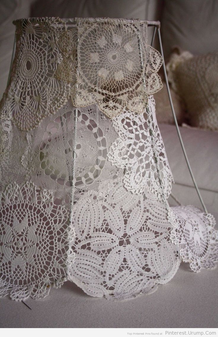 an image of a bag made out of crocheted doily on the bed