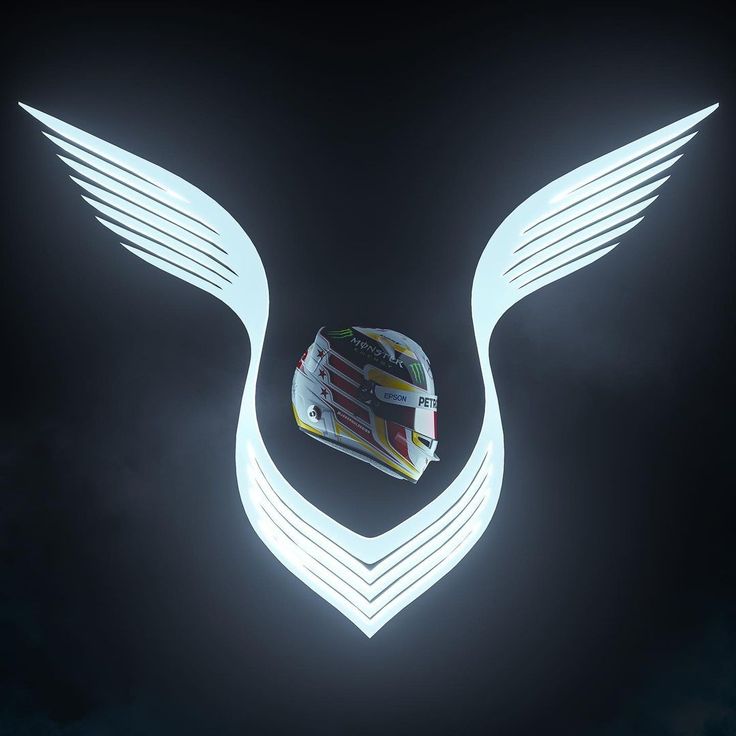 a helmet with wings on it is lit up in the dark