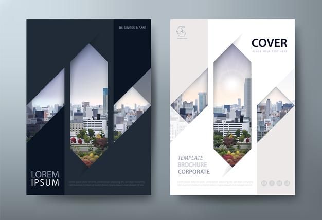 a set of two vertical brochures with cityscape in the back and side