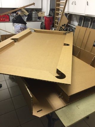 two cardboard boxes stacked on top of each other