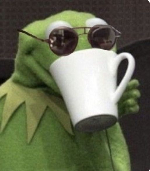 the frog is wearing sunglasses and holding a coffee cup