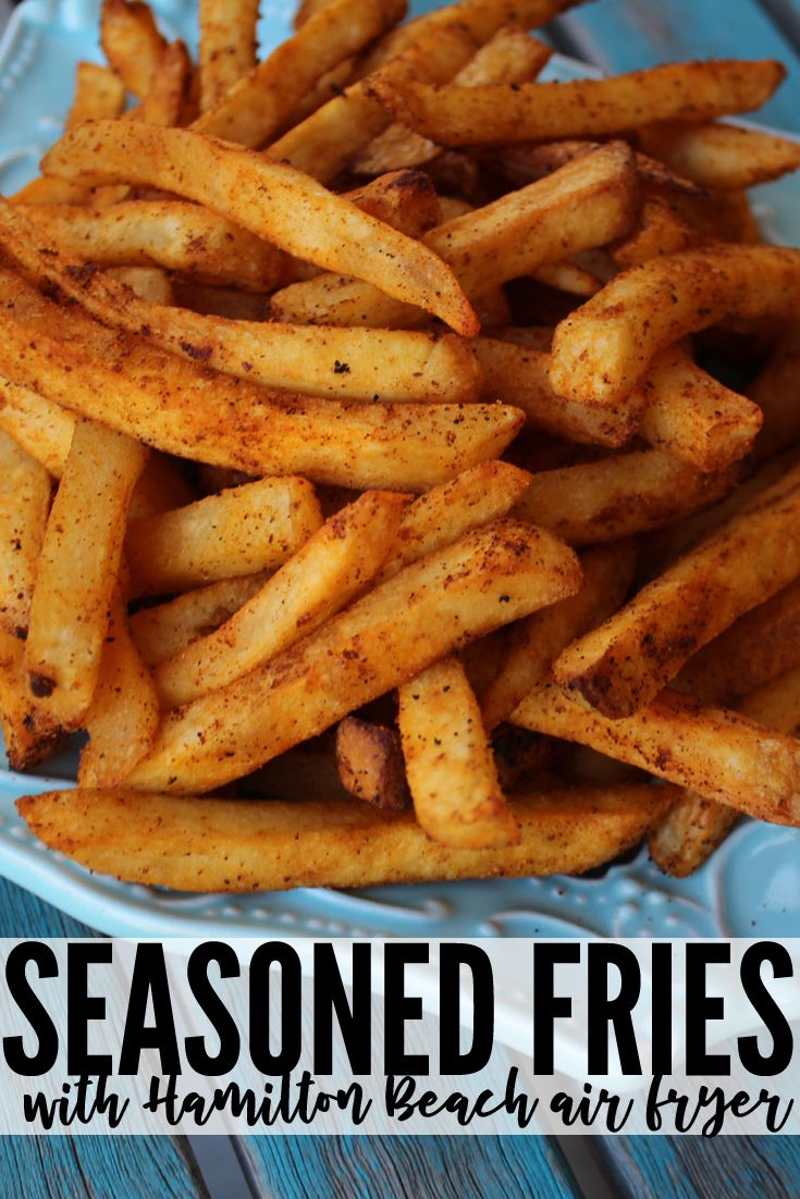 seasoned fries on a blue plate with text overlay