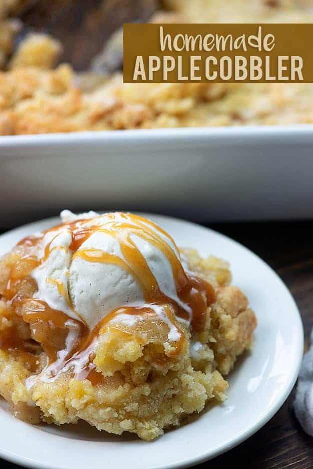 homemade apple cobbler on a plate with ice cream and caramel drizzle