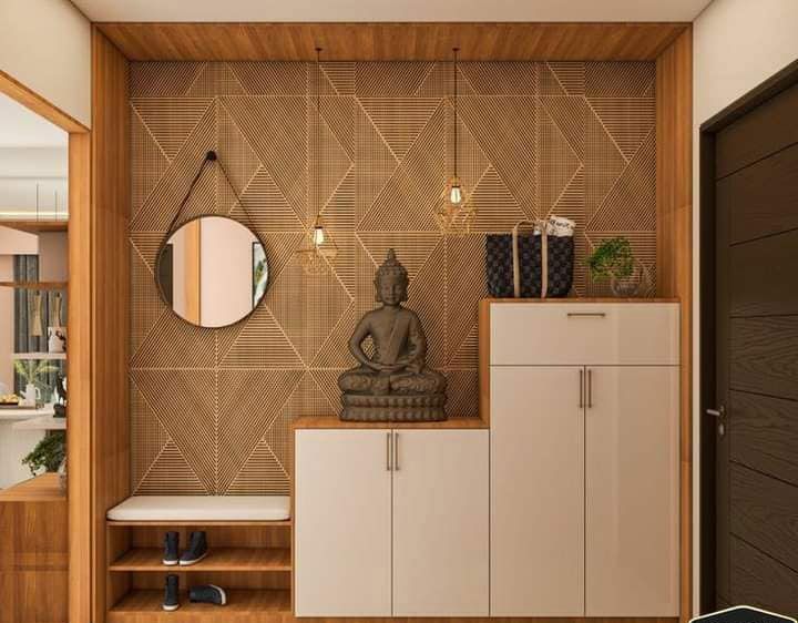 a buddha statue sitting on top of a wooden shelf next to a mirror and cupboard