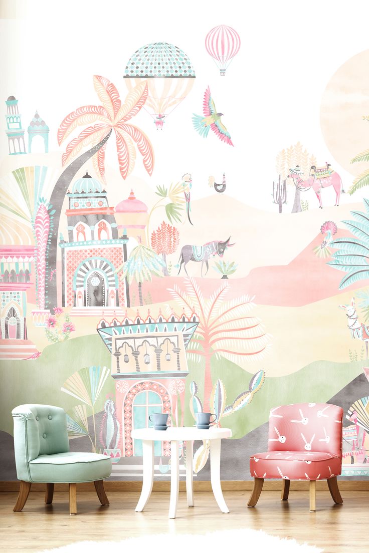 two chairs and a table in front of a colorful wallpapered room with palm trees