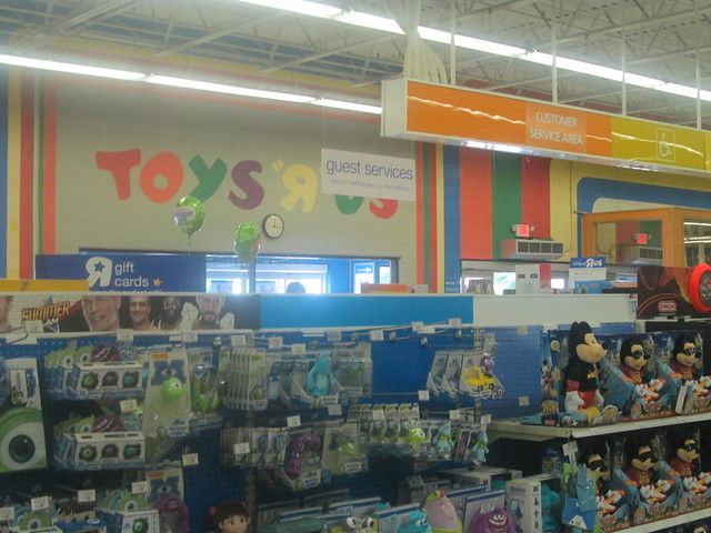 there are many toys on the shelves in this toy store that is filled with children's merchandise