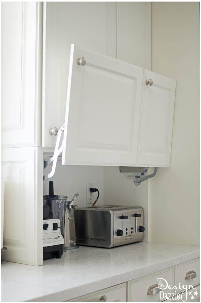 a toaster oven sitting on top of a kitchen counter next to a microwave and toaster