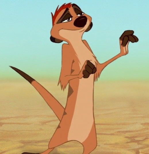 a cartoon character standing in the desert with one foot up and two hands on his hip