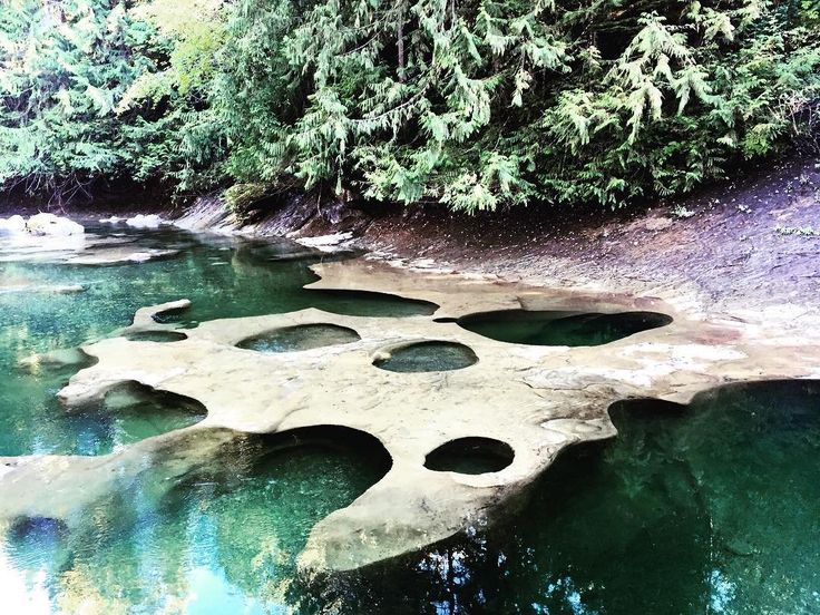 the water is very clear and blue with holes in it