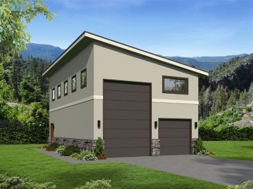 a two car garage in the middle of a lush green field with mountains in the background