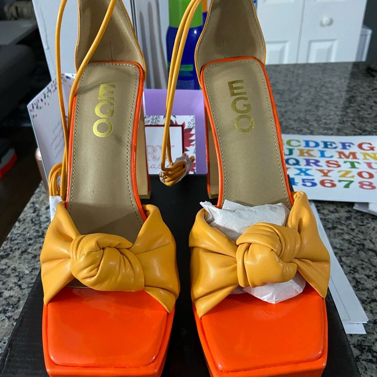 Orange And Yellow Fun Strappy Heel Brand New Never Worn. Fits Larger Than An 8 Yellow Platform Heels For Party, Yellow Pointed Toe Sandals With Padded Heel, Yellow Platform High Heels, Yellow Sandals With Padded Heel And Pointed Toe, Yellow Synthetic Platform Heels, Chic Yellow Square Toe Sandals, Yellow Heels With Wrapped Heel For Party, Yellow Party Heels With Padded Heel, Yellow Party Heels With Wrapped Heel