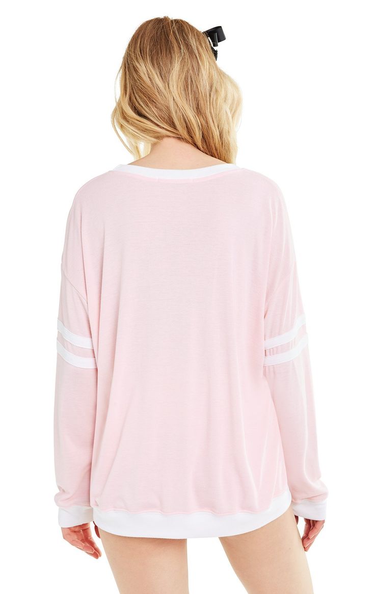 The Wonderland Moonlight sweater from Wildfox is a slightly oversized sweatshirt with white banded hems, and sporty white stripes on each sleeve. It features the graphic 'Take Me To Wonderland' at front. 50% Polyester, 50% Rayon Fall Tops With Striped Cuffs And Relaxed Fit, Sporty Tops With Striped Cuffs For Fall, Oversized Striped Top For Layering, Oversized Tops With Contrast Stripes For Layering, Sporty Relaxed Fit Sweatshirt With Contrast Stripes, Sporty Sweatshirt With Contrast Stripes And Relaxed Fit, Relaxed Fit Crew Neck Top With Striped Cuffs, Spring White Sweatshirt With Contrast Stripes, White Spring Sweatshirt With Contrast Stripes