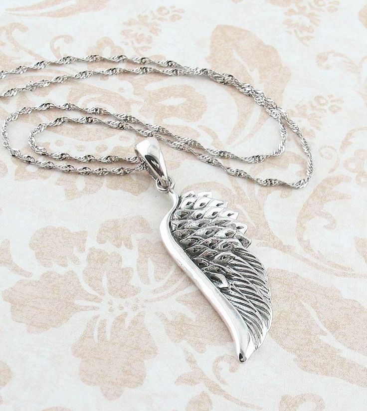 Splendid Angel Wing Necklace in Sterling Silver | FREE Shipping in USA – woot & hammy Silver Winged Engraved Jewelry, Silver Leaf-shaped Necklaces For Gift, Spiritual Winged Sterling Silver Jewelry, Silver Leaf-shaped Necklace Gift, Silver Leaf-shaped Necklace For Gift, Silver Teardrop Pendant Locket Necklace, Silver Engraved Wing-shaped Jewelry, Engraved Winged Sterling Silver Jewelry, White Gold Pendant Necklace For Memorials