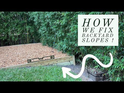 an image of how we fix backyard slopes in the back yard with wood and grass