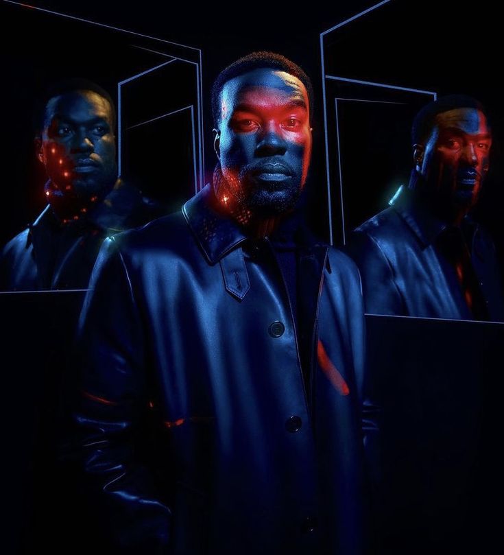 three men standing in front of mirrors with red lights on their faces