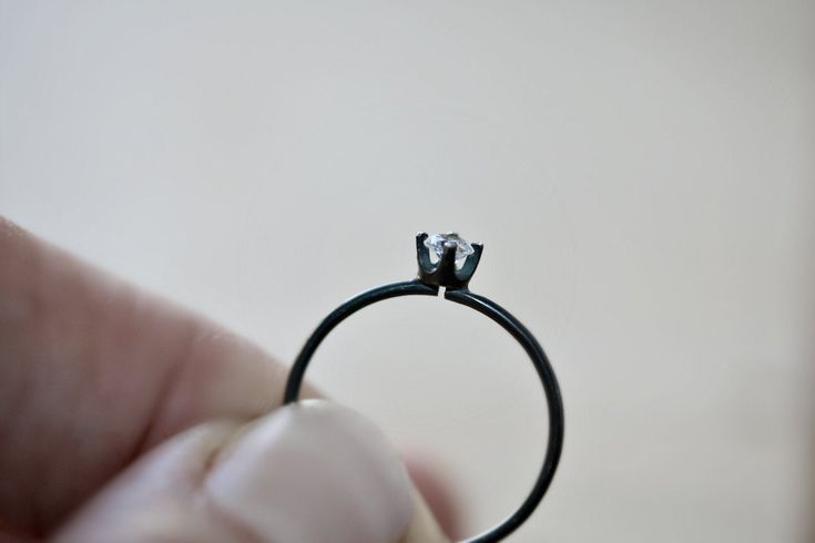 Minimalist and delicate, this dainty matt black silver ring features a brilliant sparkly cubic zirconia gemstone, a striking contrast against the oxidized ring band, an affordable and eco friendly alternative to a real diamond. Diameter of Stone | 3 mm Diameter of Wire | 1 mm This ring can be custom made with other gemstones, please ask for details. Shipping includes insurance up to 33 euro and tracking Minimalist Oxidized Promise Ring, Minimalist Oxidized Finish Promise Ring, Minimalist Hand Forged Black Rings, Oxidized Ring, Style Reference, Aesthetic Style, Stackable Ring, Ring Band, Steel Ring