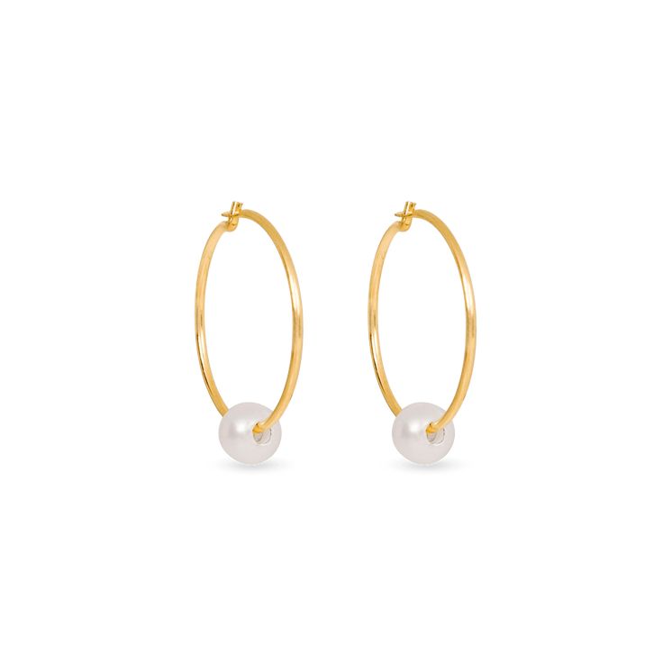 We’re picky about our pearls. Our collection of modern-feel pearl pieces takes your grandmother's favorites and incorporates them into the latest trends, interpreted from our NYC-gal perspective. These gem-quality pearls are freshwater cultured beauties, set in solid gold that won't tarnish or flake. We may have expensive taste, but crazy mark-ups aren’t really our thing. So we balance the best quality and the best price — enough said. These Pearl Hoop Earrings are the perfect addition to your j Stone And Strand, One And Done, Earrings Stone, Ear Cuff Earings, Pearl Hoop Earrings, Freshwater Cultured Pearls, Rough Diamond, Cultured Pearls, Stone Earrings