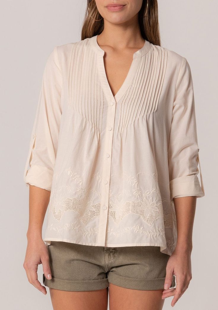 A cotton long sleeve bohemian spring blouse with embroidered detail. Cotton Embroidered Relaxed fit Long rolled sleeve with button tab closure Hip length V-neckline Self-covered button front Pintuck details Lined Bohemian spring blouse An elevated take on a classic style. Our cotton long-sleeve blouse features delicate pintuck details, a self-covered button front, and a flattering v-neckline. The embroidered detail adds a bohemian touch. Model is 5'9, wearing a size S.Style: I-15088W-SGI Long Sleeve Cotton Embroidered Top With Cuffs, Long Sleeve Cotton Blouse With Embroidered Cuffs, Bohemian Cotton Blouse With Embroidered Cuffs, Cotton Embroidered Long Sleeve Top, Spring Long Sleeve Embroidered Top, Spring Daywear Blouse With Embroidered Cuffs, Spring Daywear Blouse With Embroidered Sleeves, Spring Long Sleeve Top With Embroidered Cuffs, Cotton Embroidered Cuff Long Sleeve Top