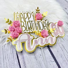 a happy birthday cake topper with pink roses