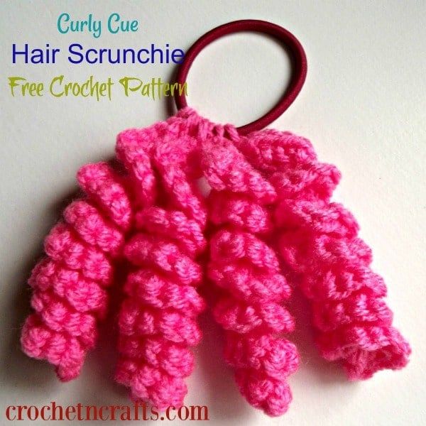 pink crocheted hair scrunchies are on a white surface with the words, curly cute hair scrunches free crochet pattern