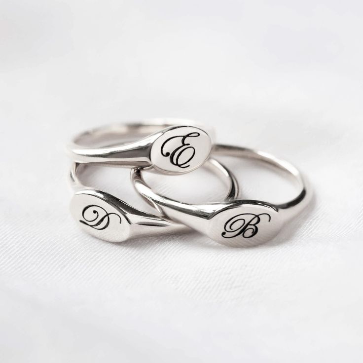 Our stunning oval signet ring is the perfect addition to any jewelry collection, with an unqiue engraving that brings a personal touch to this timeless piece. Sterling Silver Hypoallergenic, lead and nickel free Made in NYC Side Oval width 8mm x Height 5mm Band Thickness 2mm #R009-S Minimalist Oval Sterling Silver Engraved Ring, Classic Oval Stamped Signet Ring, Silver Oval Signet Ring As Gift, Classic Hand Stamped Engraved Wedding Ring, Elegant Hand Stamped Engraved Ring As A Gift, Classic Hand Stamped Rings, Classic Wedding Engraved Hand Stamped Ring, Classic Wedding Engraved Hand-stamped Ring, Silver Oval Engraved Ring With Engraving Option