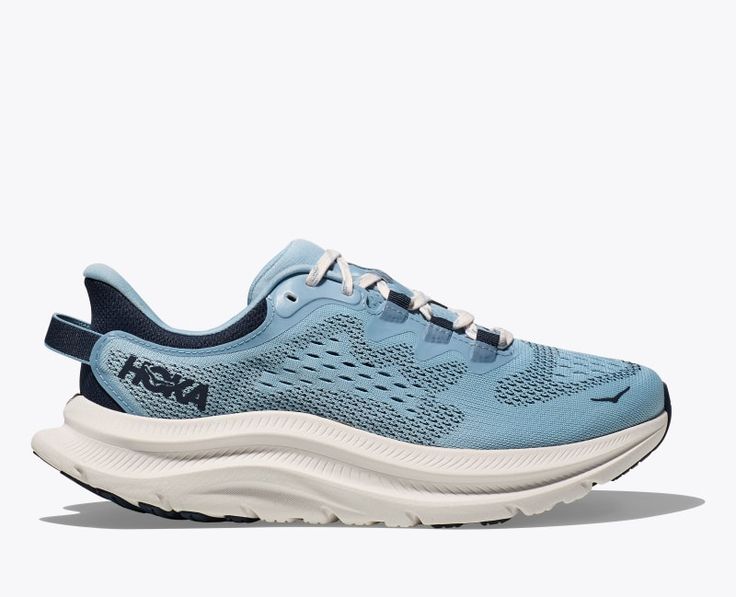 An accessible trainer that delivers a well-balanced ride, the Kawana 2 has been fine-tuned with a single-layer mesh upper, sock-like bootie, and eye row gillies for enhanced foot lockdown. Geared for lateral side-to-side movement, this go-to trainer easily shifts from street to studio with a speckled regrind midsole and gum rubber outsole. | Features. Single-layer mesh upper. Eye row gillies. Internal bootie. Speckled Regrind midsole. Gum rubber outsole. Pull tab at heel. Subtle hits of reflectivity. Hoka Shoes Woman, Hoka Shoes, 2025 Vision, Hoka One One, Information Design, Women's Fitness, Pull Tab, Comfortable Shoes, The Row