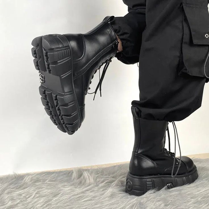 These combat boots embody the grunge aesthetic, featuring adjustable lace-up ties and a convenient zip closure. The silver accessories on the platform add a distinct edge, making them perfect for anyone who loves casual, cool, punk, or streetwear styles. Grunge aesthetic Adjustable lace-up ties Zip closure Silver accessory details on platform Faux leather Heel height: 6cm (2.3inc) Winter Alternative Style Lace-up Martin Boots, Fall High-top Combat Boots For Concerts, Winter High-top Martin Boots For Concerts, High Ankle Platform Martin Boots For Streetwear, Punk Martin Boots With Lug Sole For Streetwear, Winter Combat Boots For Concerts With Round Toe, Trendy Winter Lace-up Boots For Concert, High-top Lug Sole Boots For Concerts, High-top Boots With Lug Sole For Concerts